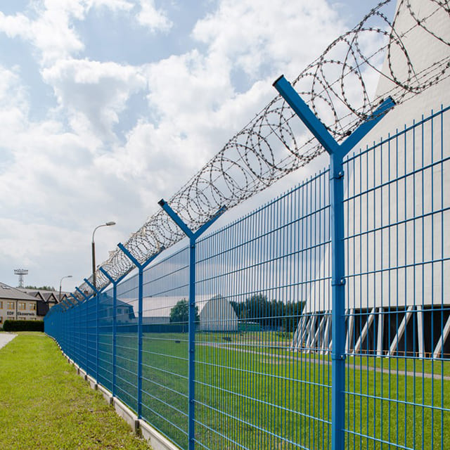 Blue Perimeter Fencing with Razor Wire